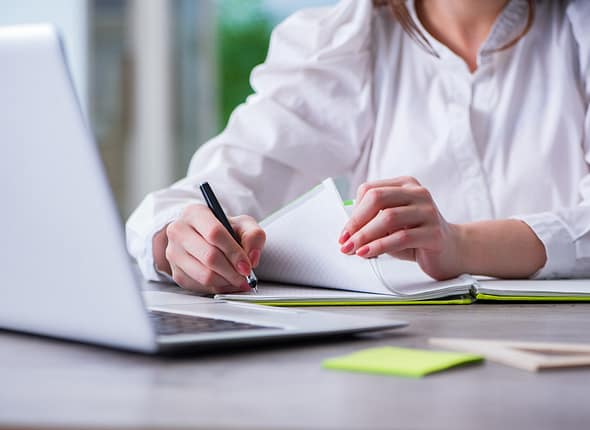 Woman,Hands,Working,On,Computer,At,Desk